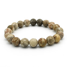 Carica l'immagine nel visualizzatore di Gallery, Bracciale unisex Corallo fossile 10 mm sfaccettati