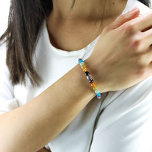 Carica l'immagine nel visualizzatore di Gallery, Bracciale unisex Sette chakra con onice nero liscio 6 mm e zama