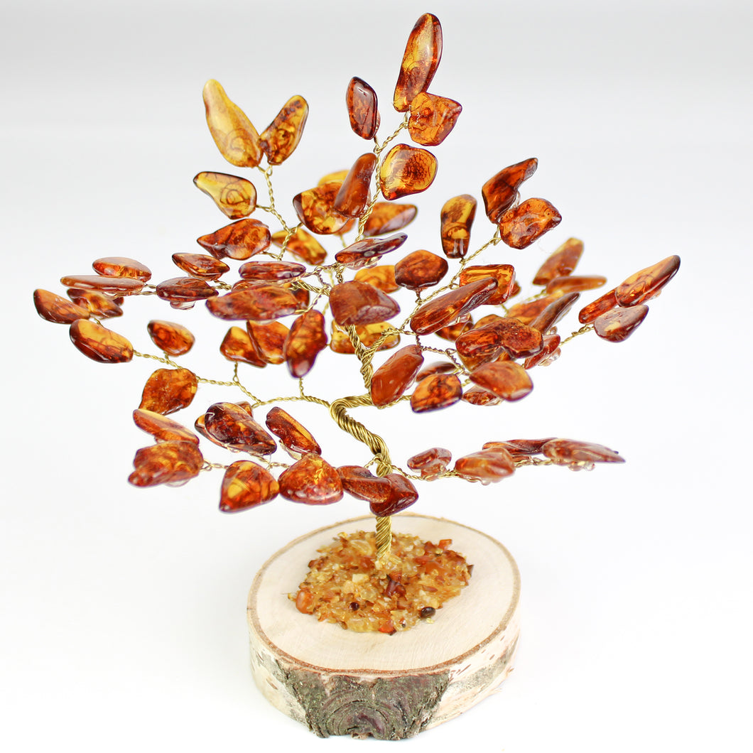 Alberello composto da ambra dei balcani e filo in ottone con base in legno
